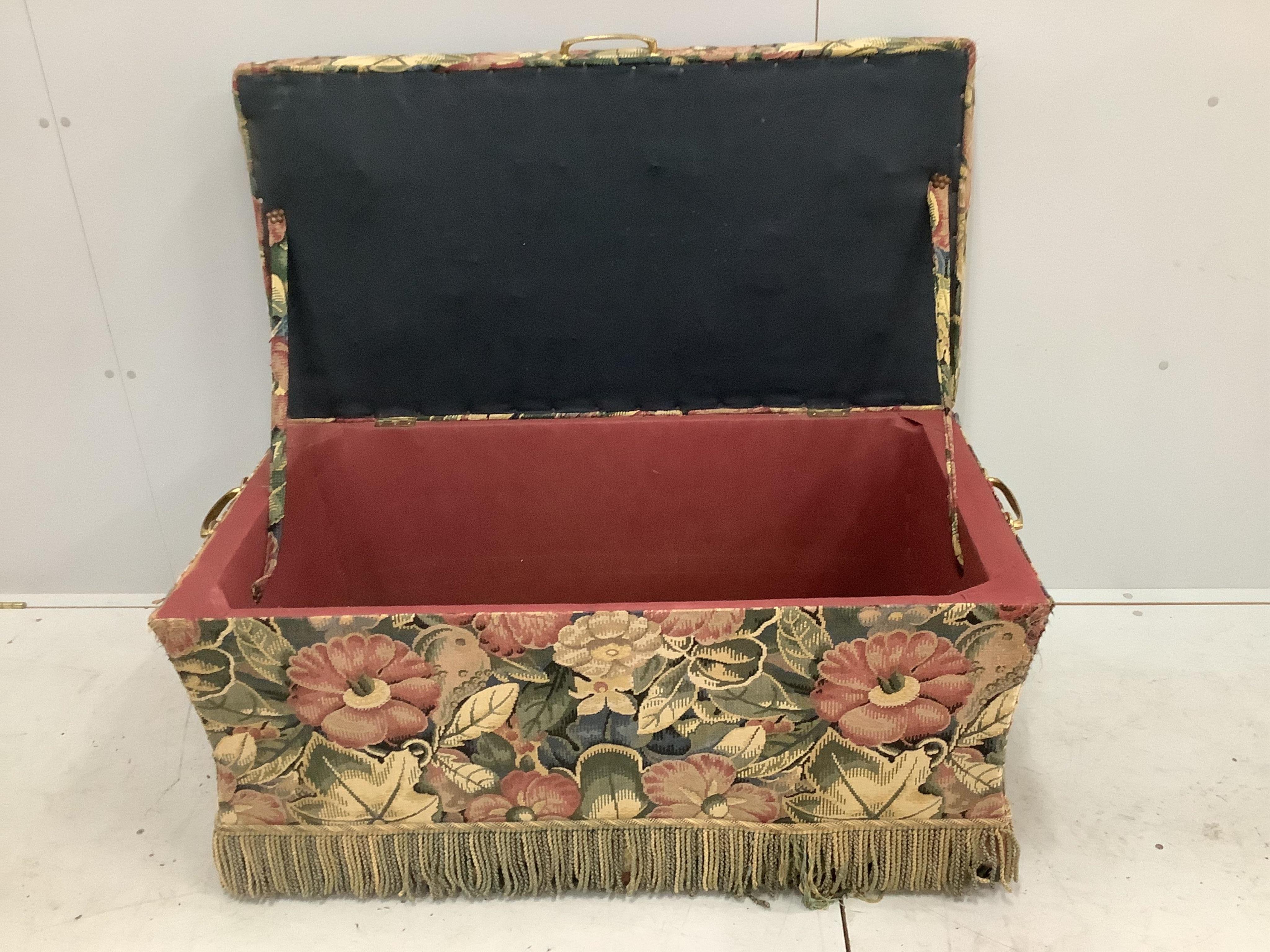 A floral upholstered box ottoman, with side carrying handles, width 110cm, depth 56cm, height 56cm. Condition - fair